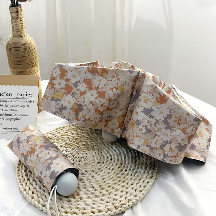 Damer Sammenleggbart paraply med elegant blomsterdesign Luvikno