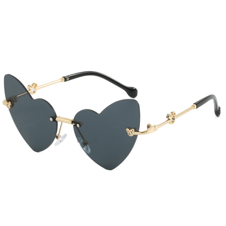 Damer hjerteformet solbrille med dekorert ramme Luvikno