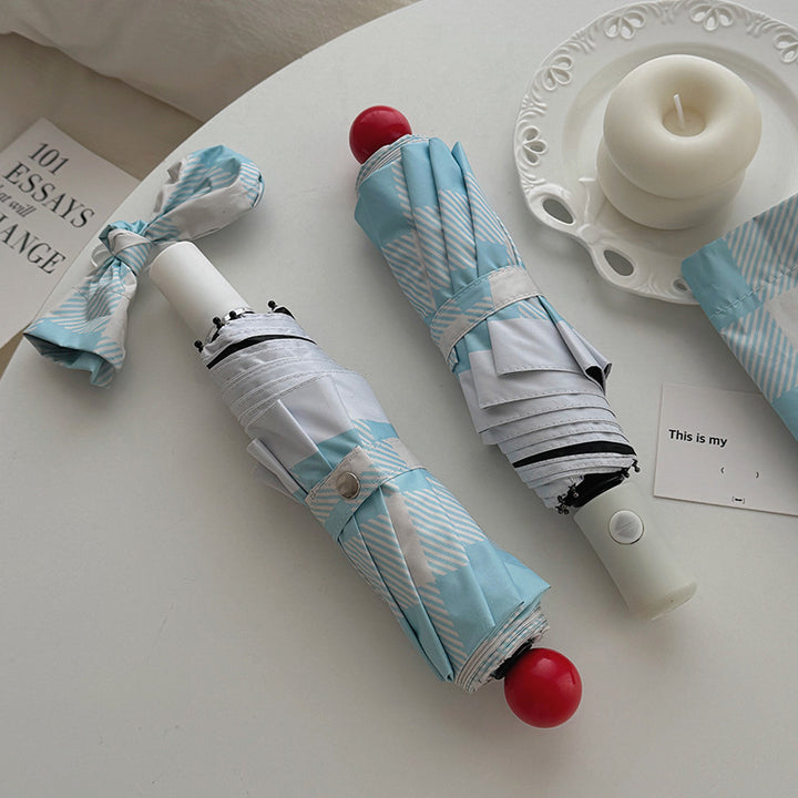 Dame sammenleggbart paraply med spesiell design Luvikno