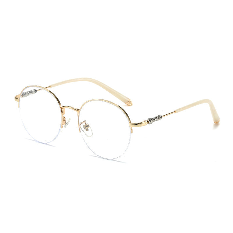 Dame rund solbrille med elegant metallramme og komfortable nesepads Luvikno