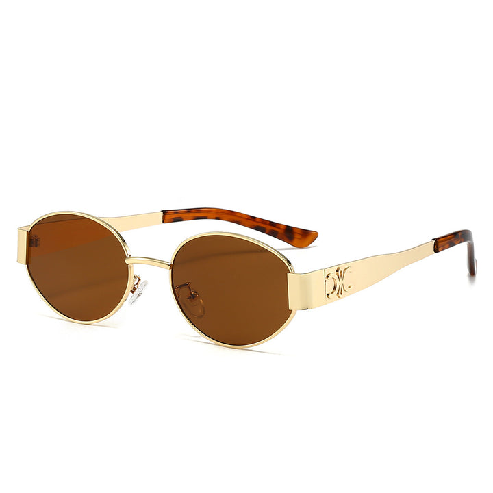 Dame Designer-solbrille med elegant oval ramme og unike aksenter Luvikno