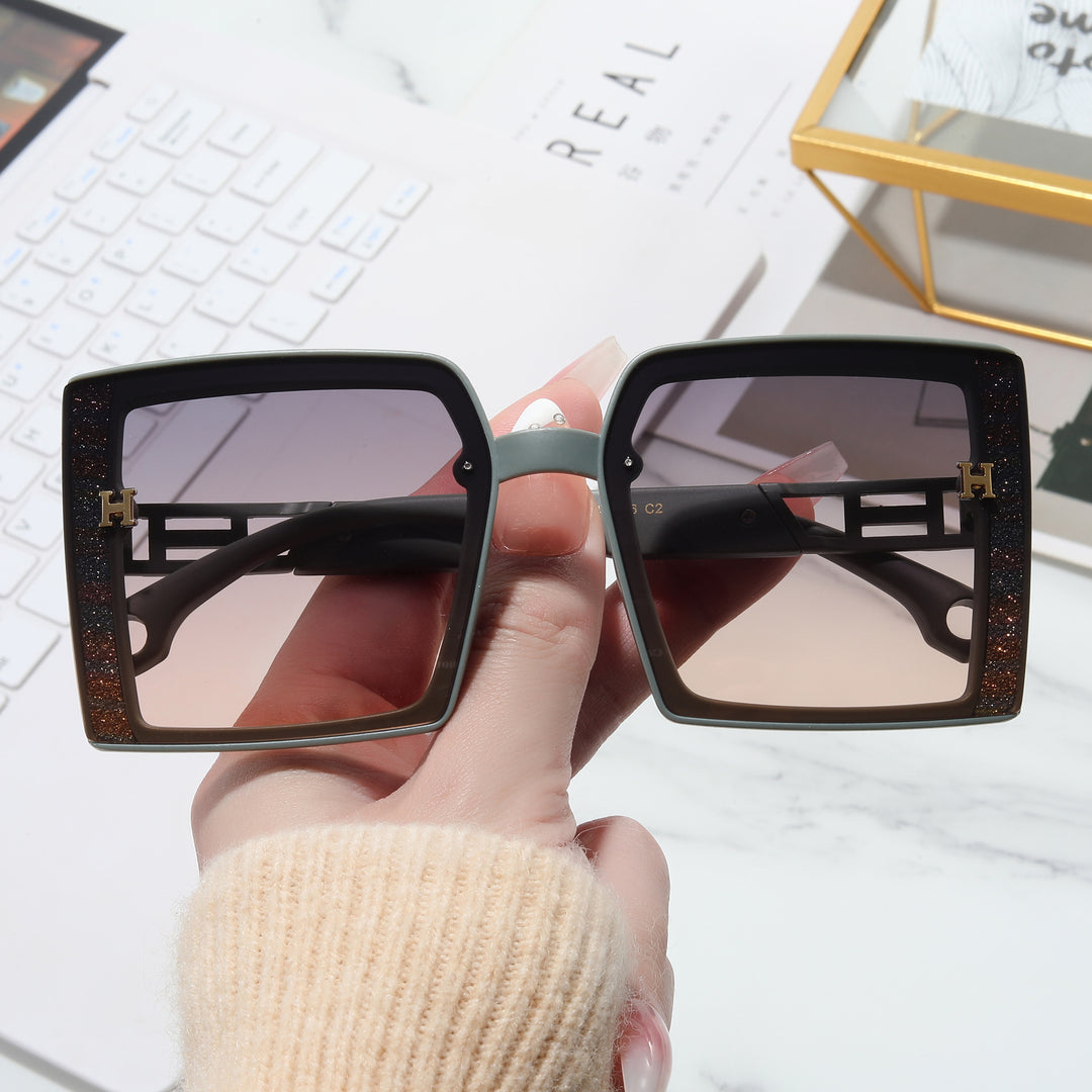Dame trendy solbrille med ekstravagant, rektangulær ramme Luvikno