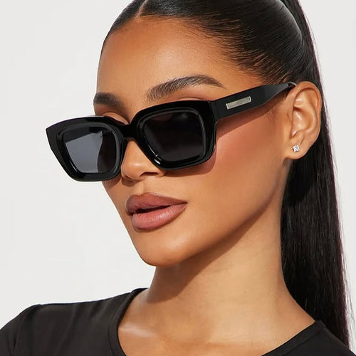 Dame kvadratisk solbrille med gjennomsiktig ramme og brune glass Luvikno