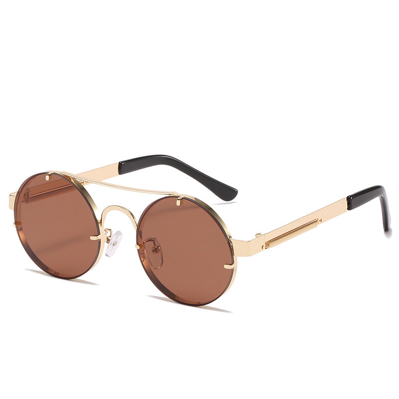 Dame rund designer solbrille med innovativ metallramme og beskyttende linser Luvikno