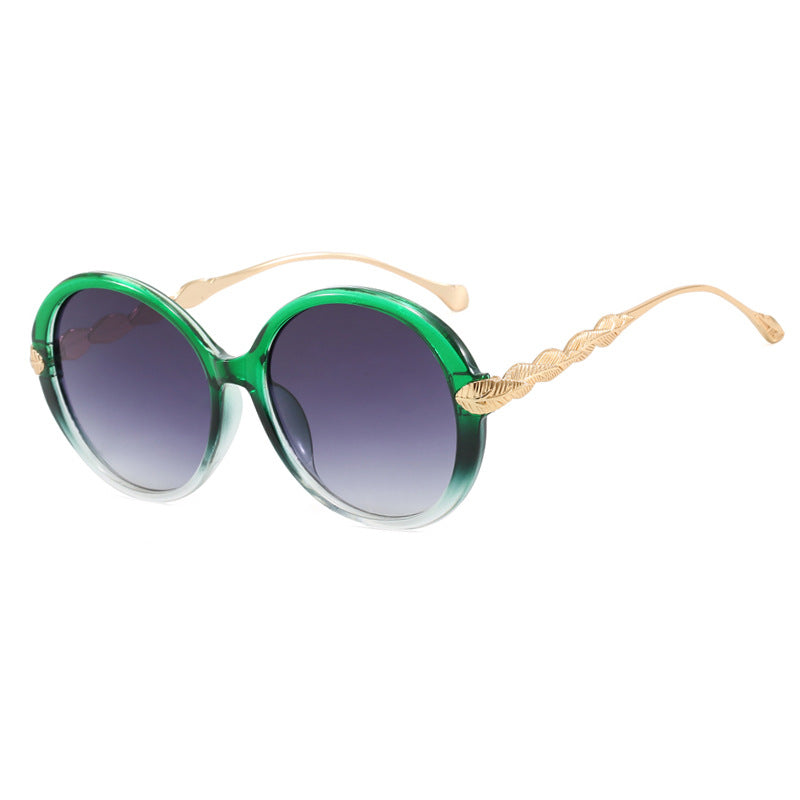 Dame stor rund solbrille med dekorative metalakser Luvikno