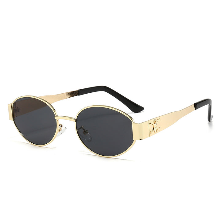 Dame Designer-solbrille med elegant oval ramme og unike aksenter Luvikno