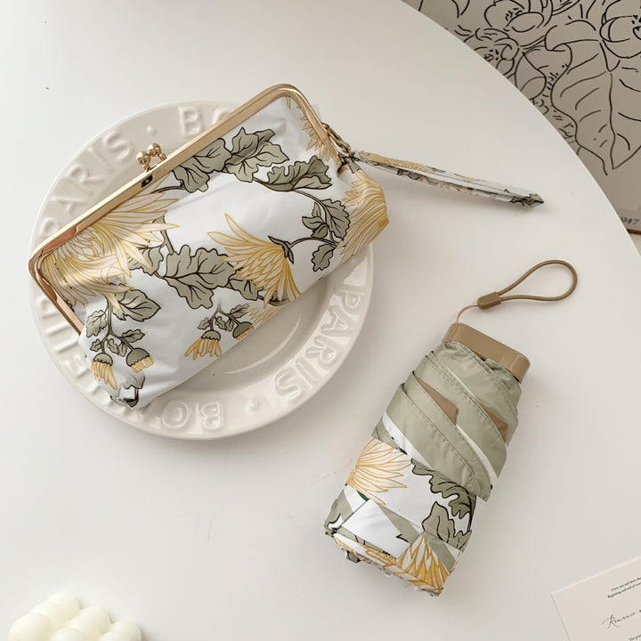 Damer elegant foldeparaply med blomsterdesign og praktisk etui Luvikno