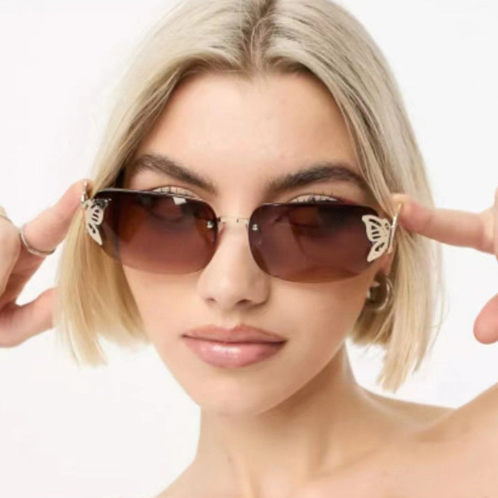 Dame moteriktig solbrille med filigran sommerfugldesign og beskyttende glass Luvikno