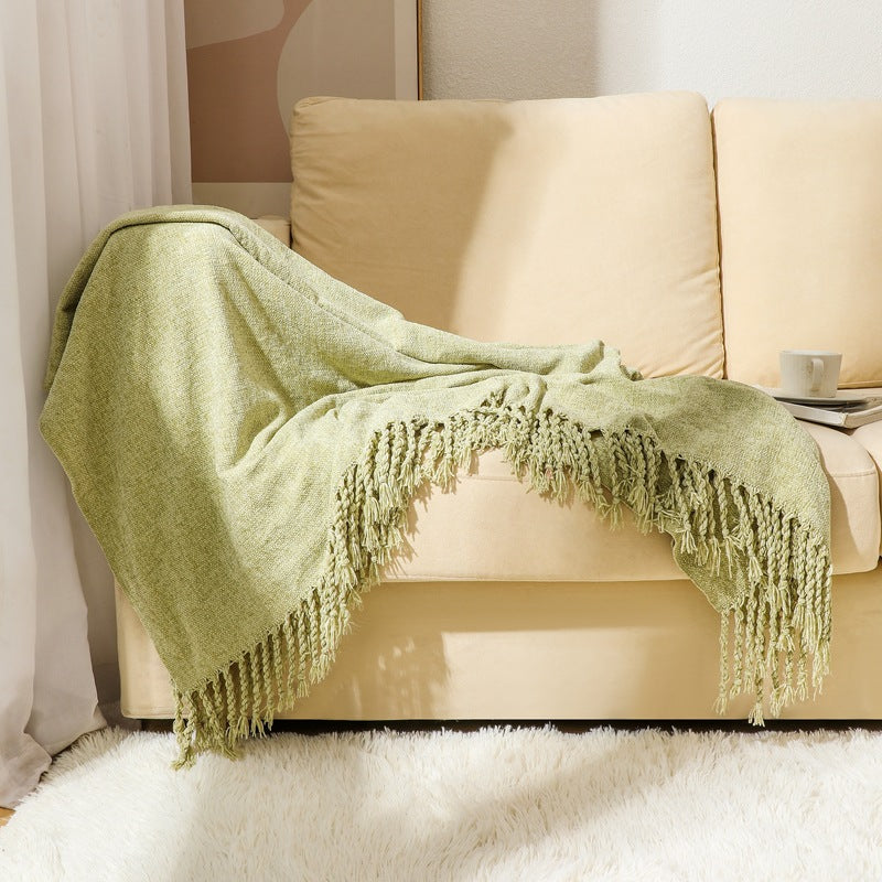 Kvinnelig elegant og stilfull sofa teppe med frynser Luvikno