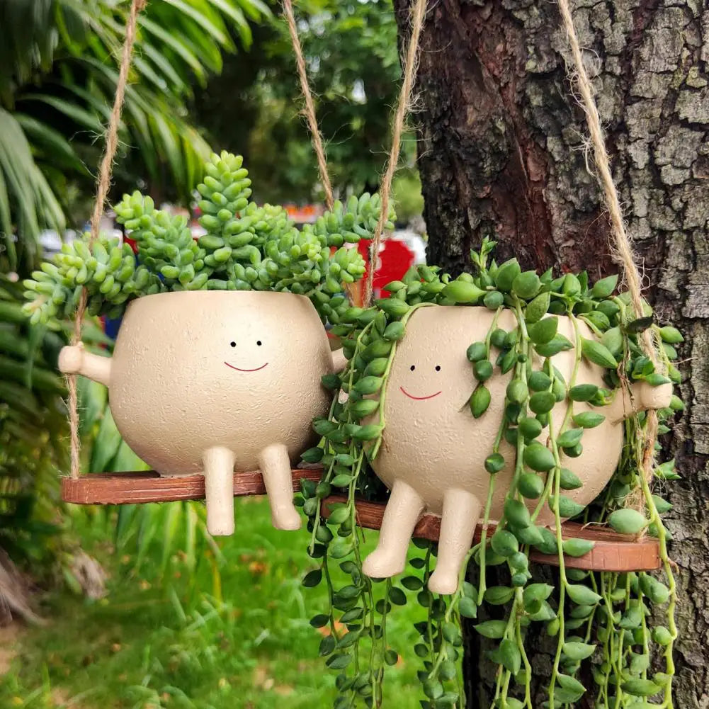 Svingende Smilende Ansikt Blomsterkrukke
