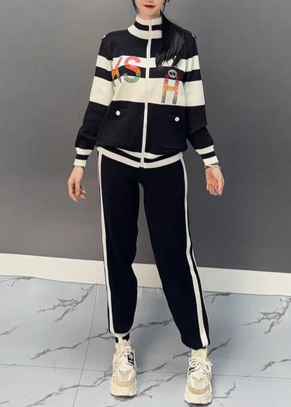 Luvik | Musta puolipaneeli kauluksella oleva patchwork-takki ja leveälahkeiset housut Kaksiosainen asu