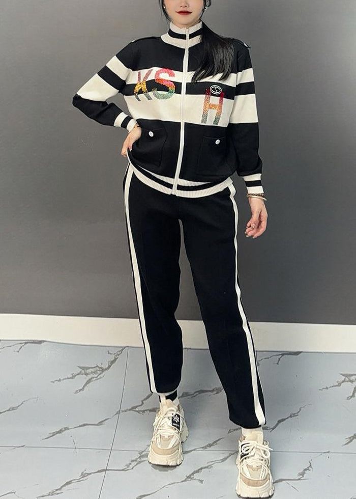 Luvik | Musta puolipaneeli kauluksella oleva patchwork-takki ja leveälahkeiset housut Kaksiosainen asu