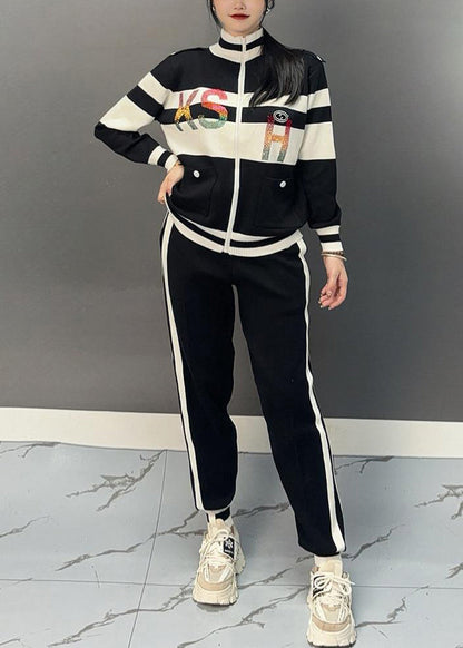 Luvik | Musta puolipaneeli kauluksella oleva patchwork-takki ja leveälahkeiset housut Kaksiosainen asu